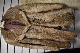 A vintage fur coat, medium to large size.