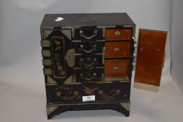 An early 20th century Chinese table top stationary box having internal rack and eight drawers,