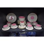 A selection of Victorian tea wares, having white ground with pink interiors and textured design with