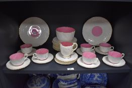 A selection of Victorian tea wares, having white ground with pink interiors and textured design with