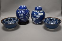 Two ginger jars, having cherry blossom decoration on blue ground, and two Japanese bowls.