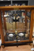 An early to mid 20th century set of scientific scales in glass and oak case, marked Sartorius-