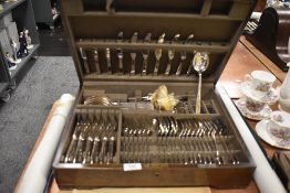 A vintage oak, mostly complete canteen of Mappin and Webb cutlery.
