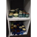 A large collection of mixed studio pottery table ware and vases, including Wetheriggs.