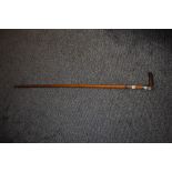 A Victorian walking cane, having hall marks for Birmingham, circa 1897/8 embossed cuff to neck and