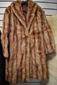 A vintage mink coat, medium to large size.
