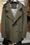 A gents Marks and Spencer over coat, having pockets to front and vented back, size large.
