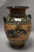 A large Lambeth Doulton aysthetic period vase, circa late 1880s, having Bird decoration to body on