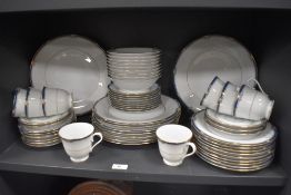 A collection of Noritake 'Impression' pattern dinner wares, having white ground with teal blue