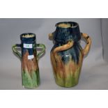 Two mid century studio pottery vases in the manner of Brannam of Barnstable, having blue, green