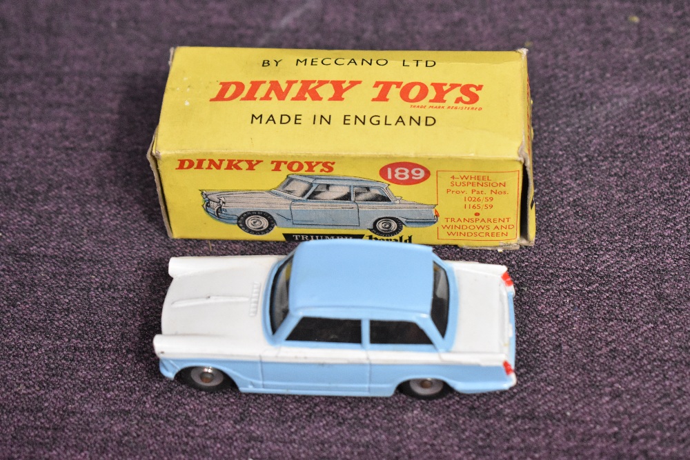 A Dinky diecast, 189 Triumph Herald in light blue and white having 4 wheel suspension, in original