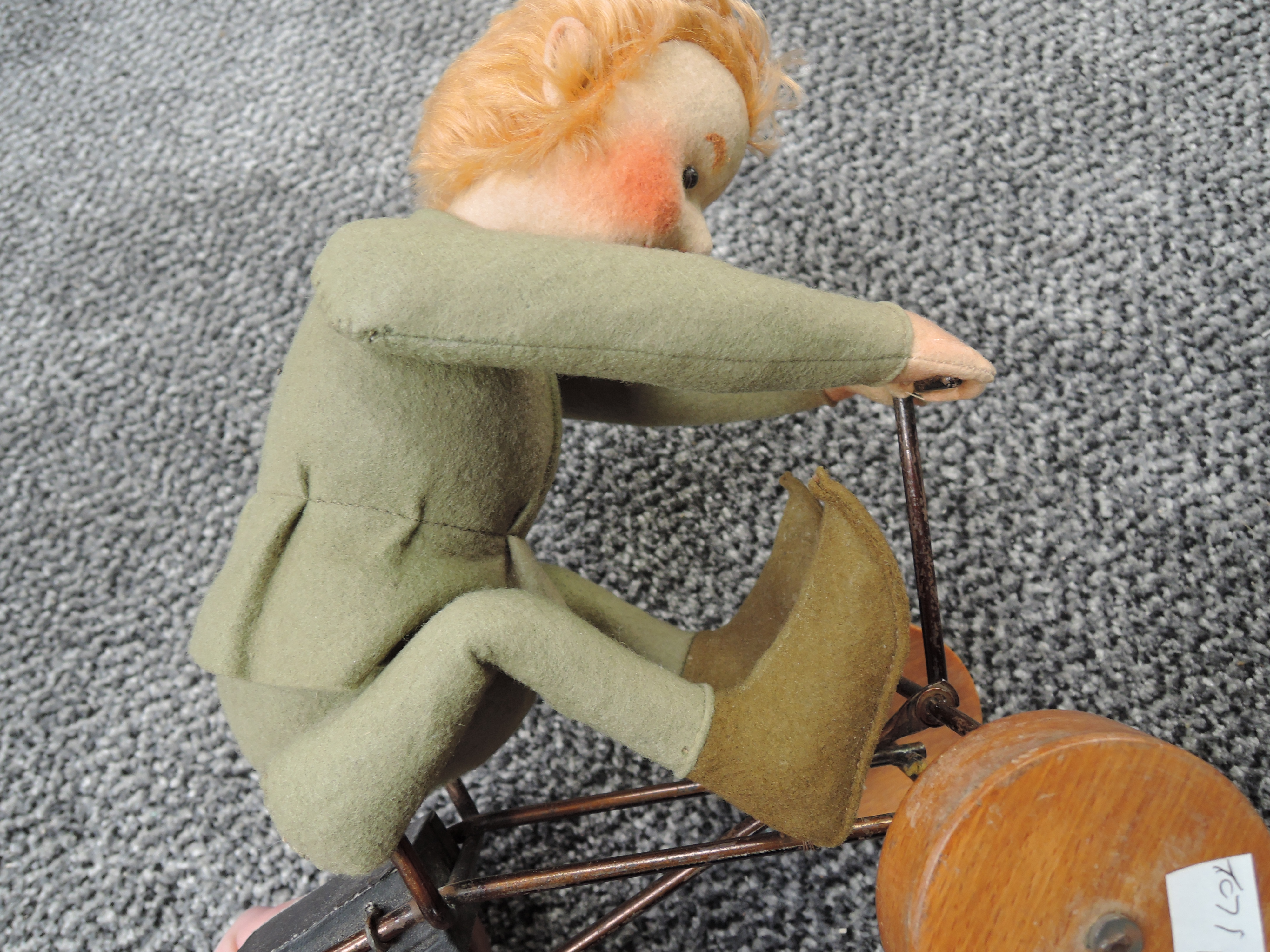 A early Steiff pull along and felt covered Boy wearing green jacket and pixie boots on metal cart - Image 11 of 14