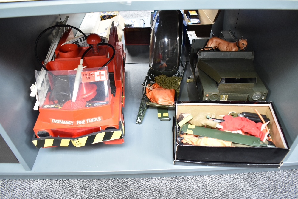 A shelf of Action Man including Transport Command Emergency Fire Tender in original box with