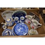 An assortment of ceramics including blue and white plates, jugs and teapots as well as a Wedgwood