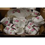 A Czechoslovakian part tea service decorated with pink roses (approx 42 pieces)