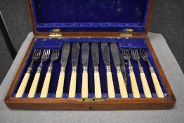 A boxed Silver plated part fish knife and folk set.