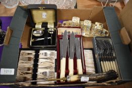 A box of assorted flat ware including fish knifes and forks, boxed cake forks, a boxed silver plated
