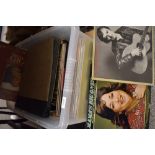 A varied selection of LP records including The Rolling Stones, Carpenters, Beach Boys, Santana,
