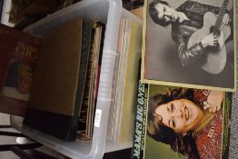 A varied selection of LP records including The Rolling Stones, Carpenters, Beach Boys, Santana,