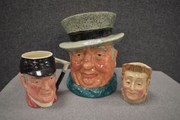 Three character jugs including a Beswick 'Pecksniff' and a Sandland Ware 'D'ye Ken John Peel'.