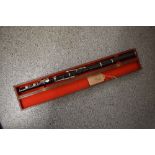 An antique wooden flute , stamped Soundy Bombay, in wooden case