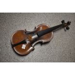 A traditional violin having inch bowed back, label unclear (Stradivarius copy), no case , sold