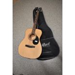 A Cort acoustic guitar , model number AF510, serial number 170215210, with branded soft case