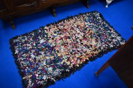 A pegged rag rug, approx. 146 x 78cm