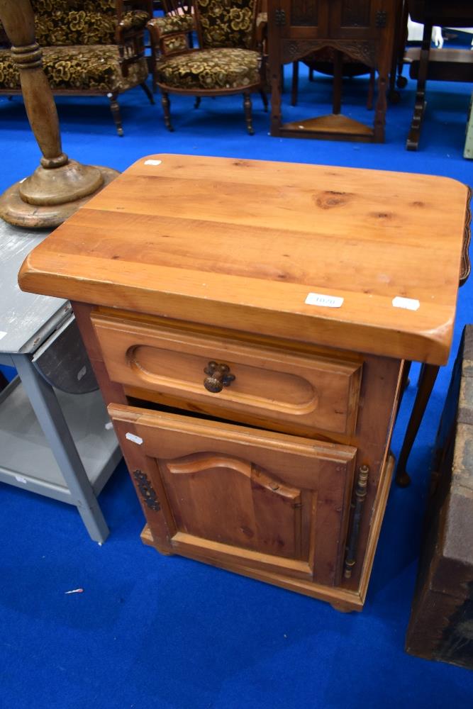 A modern pine bedside cabinet