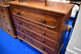 A 19th Century mahogany chest of four long drawers on turned feet, width approx 127cm