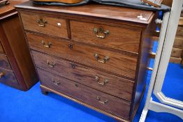 A 19th Century mahogany chest of two short over three long drawers, with brass drop handles, on