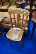 A traditional solid seat kitchen chair