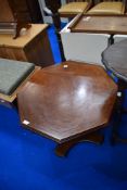 A modern mahogany occasional coffee table having octagonal top