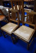 A pair of vintage golden oak Arts and Crafts style dining chairs, Beaverman (Colin Almack) with