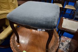 A reproduction footstool having grey dralon seat