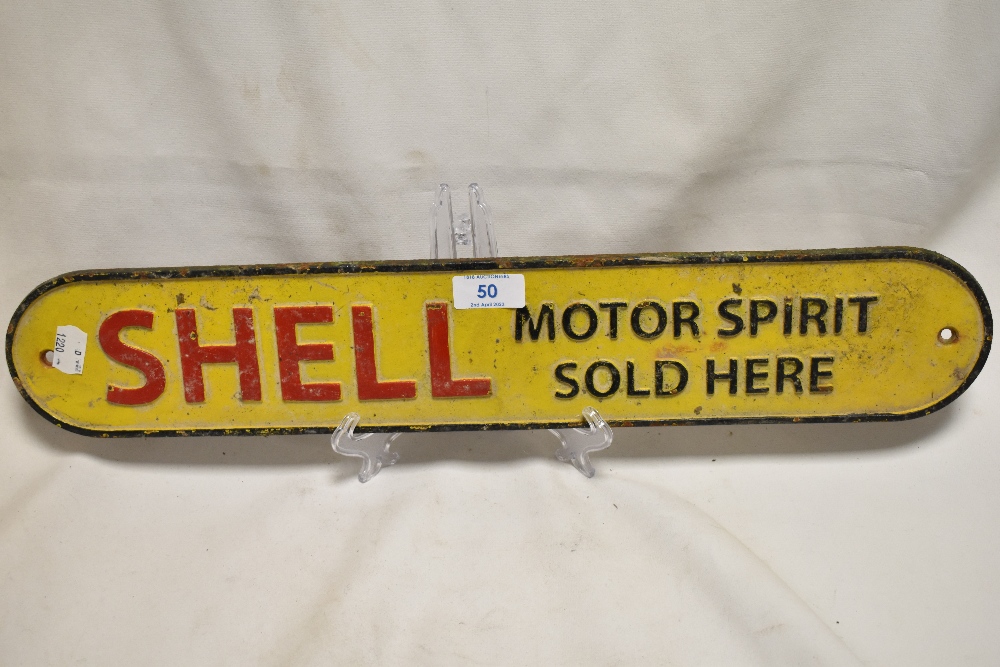 A cast iron Shell Motor Spirit Sold Here advertising sign 50cm long.