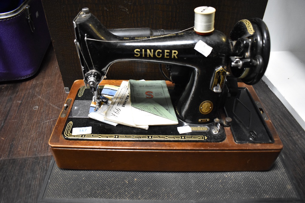 A 20th century electric Singer Sewing machine 99k with original case, accessories and manuals. - Image 2 of 6