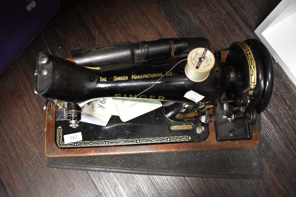 A 20th century electric Singer Sewing machine 99k with original case, accessories and manuals. - Image 5 of 6