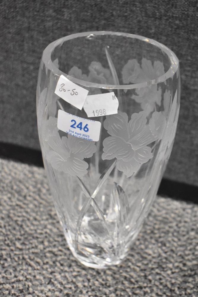 A modern Webb Corbet clear cut crystal vase with etched Daffodil design.