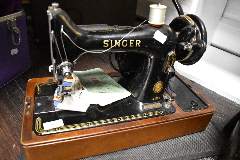 A 20th century electric Singer Sewing machine 99k with original case, accessories and manuals. - Image 3 of 6