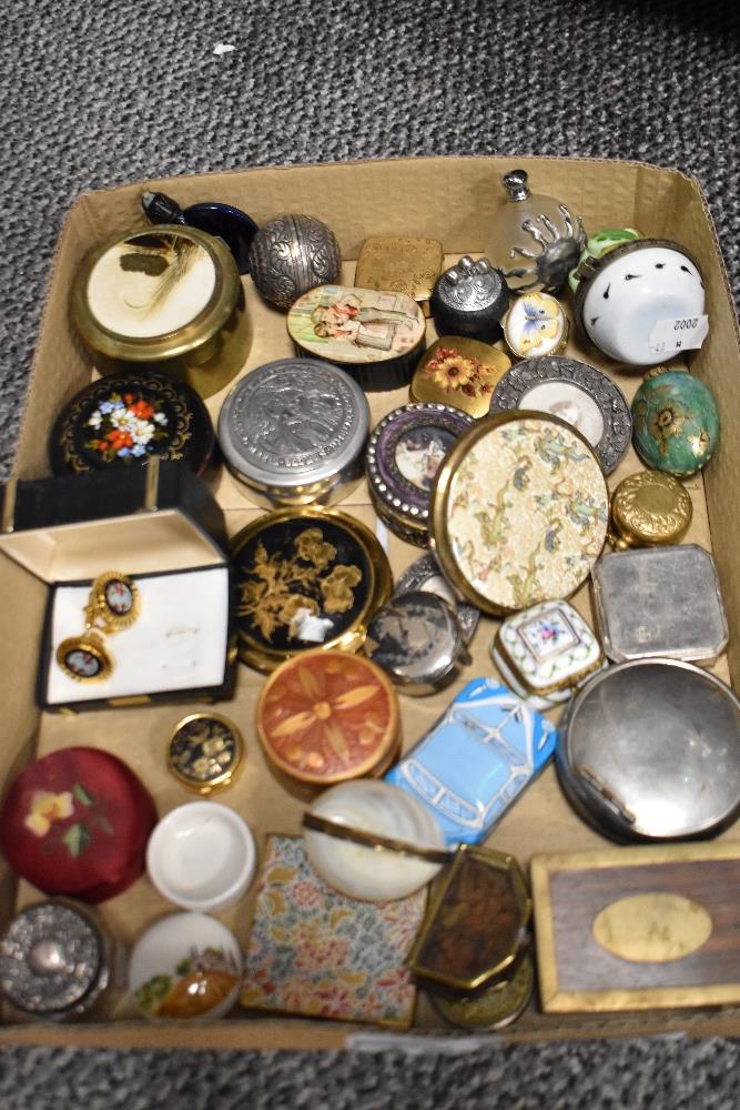 A collection of modern and vintage pill boxes, snuff style cases and trinket boxes.