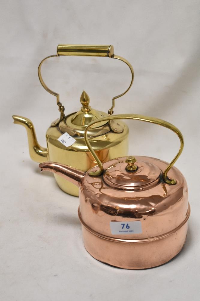 Two small sized stove kettles including one copper and one brass.