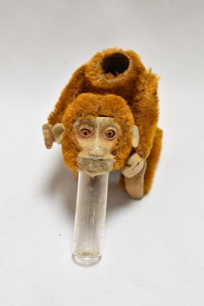 An early 20th century German Schuco monkey perfume or scent bottle having piccolo brown mohair - Image 2 of 2