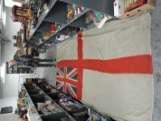 A Royal Navy White Ensign/Battle Flag, rope attached, no marking seen, 165cm x 365cm