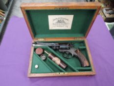 A Great Britain Adams Percussion Five Shot Revolver having chequered wooden grip, Military Marks,