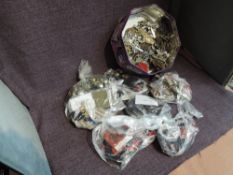 A tin containing mainly British Military Cap Badges, Buttons, Cloth Badges including RAF, Army, Navy