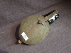 A German WW2 Wehrmacht Water Bottle with all fittings including tin cup, strap and felt covering