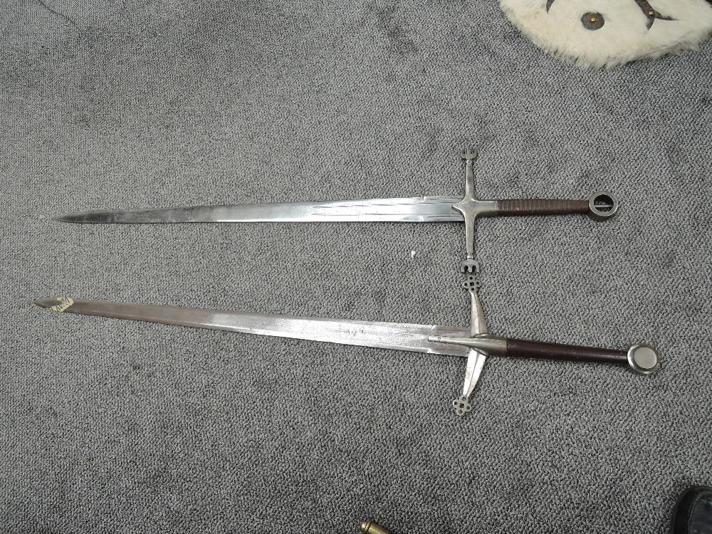 Two modern re-enactment 16th century Two Handed Broadswords, both have plain leather grips with ro