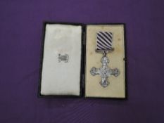 A possible Distinguished Flying Cross with Ribbon and original fitted case, on reverse dated 1944