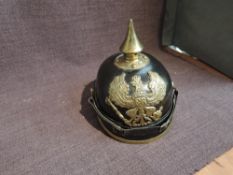 A possible reproduction or unused German Pickelhaude Helmet having metal spike and eagle holding orb